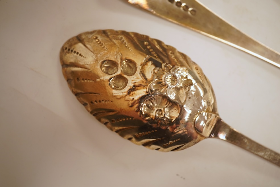 A pair of George III silver Old English pattern berry spoons, by Eley, Fearn & Chawner, London, 1810, 22.1cm, together with three Victorian silver fiddle pattern teaspoons, 6.8oz, together with a pair of plated sugar ton